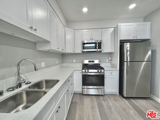 Interior, Kitchen, Recessed Lighting, Stainless Steel Appliances, Wood Texture Flooring