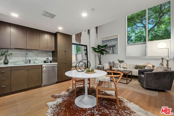 Dining room, Interior, Kitchen, Living room, Recessed Lighting, Stainless Steel Appliances, Wood Texture Flooring