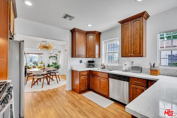 Dining room, Interior, Kitchen, Pendant Lights, Recessed Lighting, Stainless Steel Appliances, Wood Texture Flooring