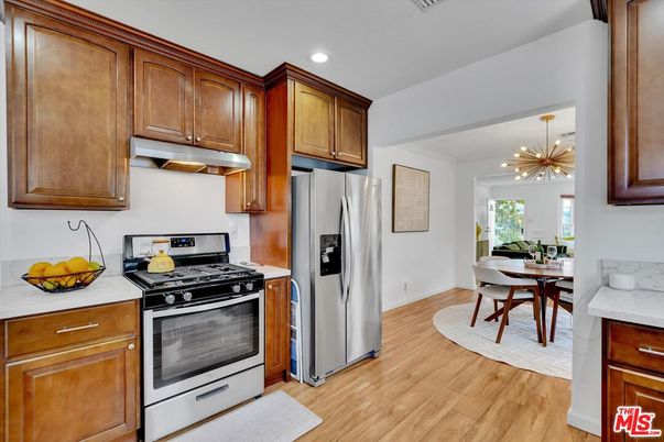 Dining room, Interior, Kitchen, Pendant Lights, Recessed Lighting, Stainless Steel Appliances, Wood Texture Flooring