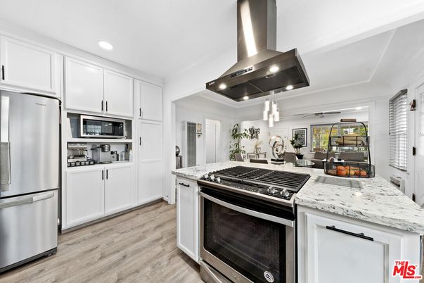 Dining room, Interior, Kitchen, Pendant Lights, Recessed Lighting, Stainless Steel Appliances, Wood Texture Flooring