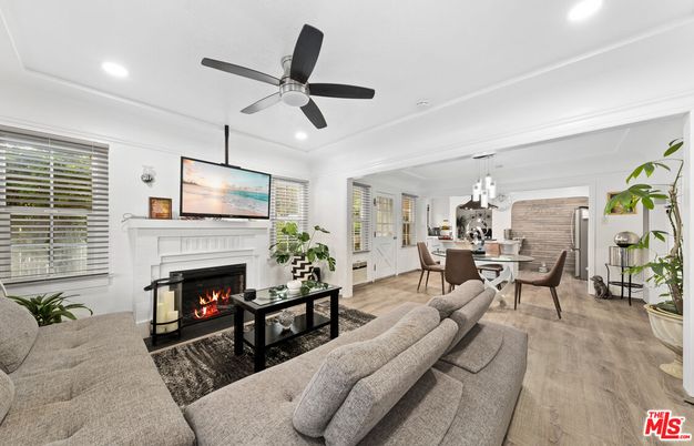 Dining room, Fireplace, Interior, Living room, Pendant Lights, Recessed Lighting, Wood Texture Flooring