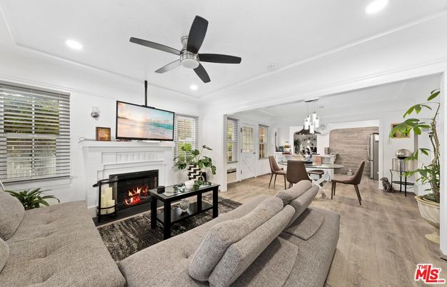 Dining room, Fireplace, Interior, Living room, Pendant Lights, Recessed Lighting, Wood Texture Flooring
