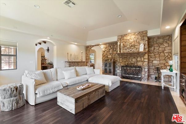 Fireplace, Interior, Living room, Recessed Lighting, Stone Walls, Wood Texture Flooring