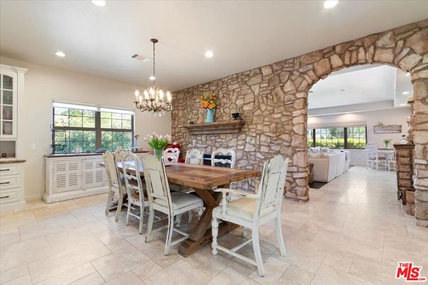 Chandelier, Dining room, Fireplace, Interior, Living room, Recessed Lighting, Stone Walls