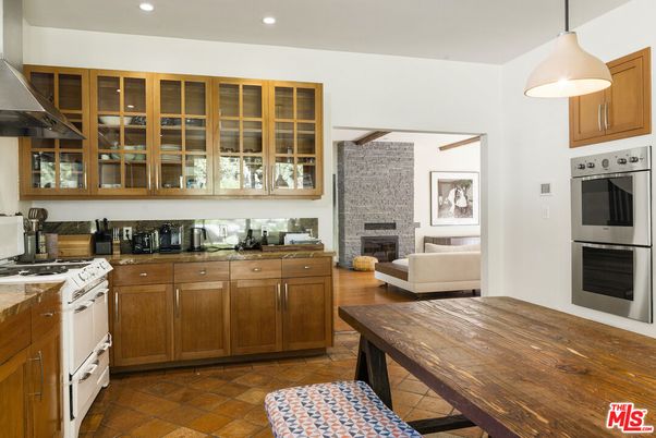 Fireplace, Interior, Kitchen, Pendant Lights, Recessed Lighting, Stainless Steel Appliances, Stone Walls