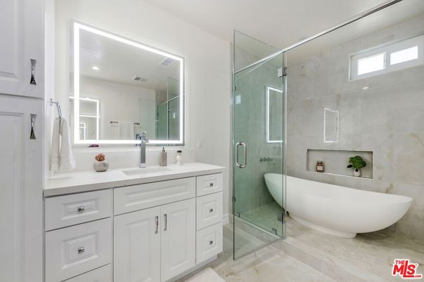Bathroom, Dual Sink Vanities, Free Standing Baths, Glass Shower, Interior, Marble Walls, Recessed Lighting