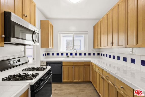 Interior, Kitchen, Tile Countertops, Wood Texture Flooring
