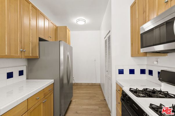 Interior, Kitchen, Tile Countertops, Wood Texture Flooring