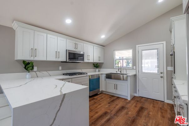 Interior, Kitchen, Recessed Lighting, Stainless Steel Appliances, Wood Texture Flooring