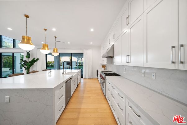 Interior, Kitchen, Marble Walls, Pendant Lights, Recessed Lighting, Stainless Steel Appliances, Wood Texture Flooring