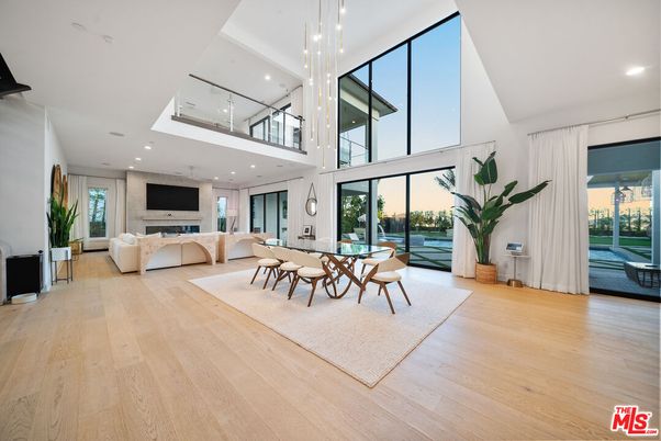 Dining room, Fireplace, Interior, Living room, Pendant Lights, Recessed Lighting, Water, Wood Texture Flooring