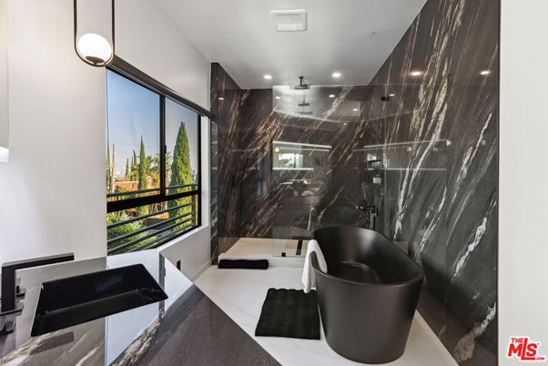 Bathroom, Free Standing Baths, Glass Shower, Interior, Marble, Marble Walls, Pendant Lights, Recessed Lighting