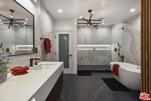 Bathroom, Dual Sink Vanities, Free Standing Baths, Glass Shower, Interior, Marble, Marble Walls, Pendant Lights, Recessed Lighting