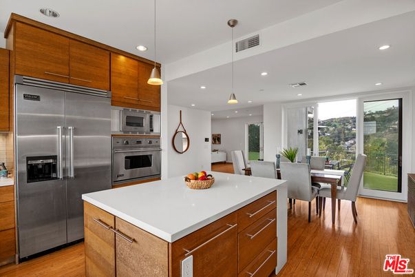Dining room, Interior, Kitchen, Pendant Lights, Recessed Lighting, Stainless Steel Appliances, Wood Texture Flooring
