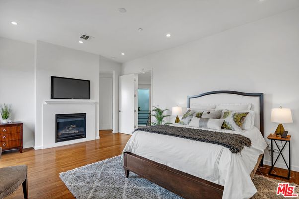 Bedroom, Fireplace, Interior, Recessed Lighting, Wood Texture Flooring