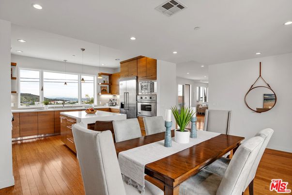 Dining room, Interior, Kitchen, Pendant Lights, Recessed Lighting, Stainless Steel Appliances, Wood Texture Flooring