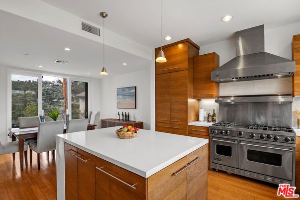 Dining room, Interior, Kitchen, Pendant Lights, Recessed Lighting, Stainless Steel Appliances, Wood Texture Flooring