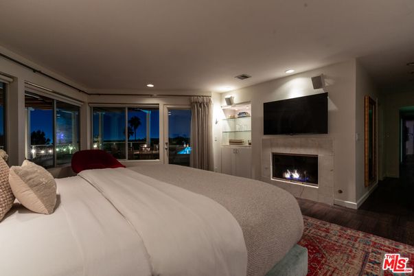 Bedroom, Fireplace, Interior, Recessed Lighting, Water, Wood Texture Flooring