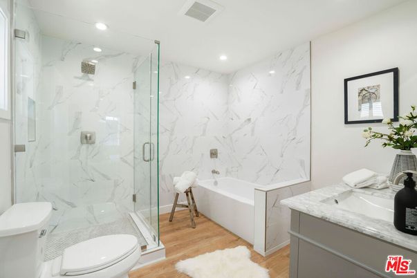 Bathroom, Glass Shower, Interior, Marble Walls, Recessed Lighting, Wood Texture Flooring
