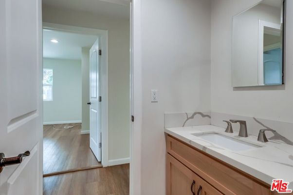 Bathroom, Dual Sink Vanities, Interior, Recessed Lighting, Wood Texture Flooring