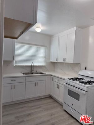 Interior, Kitchen, Marble Walls, Stainless Steel Appliances, Wood Texture Flooring