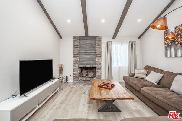 Fireplace, Interior, Living room, Recessed Lighting, Stone Walls, Wooden Beams, Wood Texture Flooring