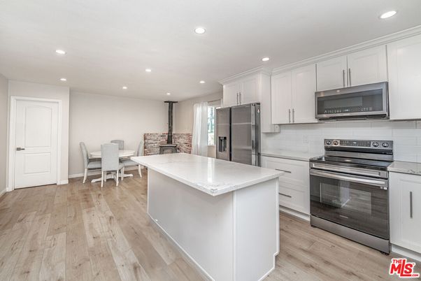 Dining room, Interior, Kitchen, Recessed Lighting, Stainless Steel Appliances, Wood Texture Flooring
