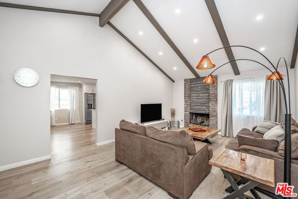Fireplace, Interior, Living room, Recessed Lighting, Stone Walls, Wooden Beams, Wood Texture Flooring