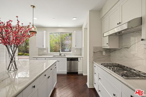 Interior, Kitchen, Marble Walls, Recessed Lighting, Stainless Steel Appliances, Wood Texture Flooring