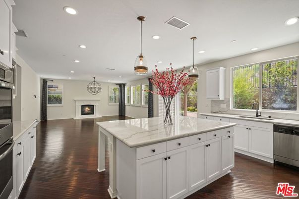 Fireplace, Interior, Kitchen, Pendant Lights, Recessed Lighting, Stainless Steel Appliances, Wood Texture Flooring