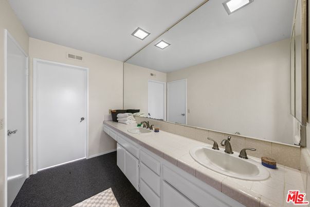 Bathroom, Dual Sink Vanities, Interior, Recessed Lighting, Tile Countertops