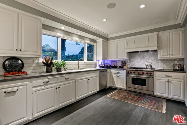 Interior, Kitchen, Marble Walls, Recessed Lighting, Stainless Steel Appliances, Wood Texture Flooring