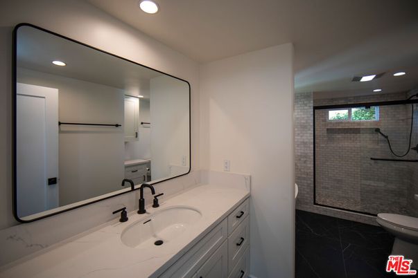 Bathroom, Dual Sink Vanities, Glass Shower, Interior, Marble, Recessed Lighting