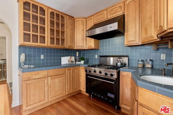 Interior, Kitchen, Stainless Steel Appliances, Tile Countertops, Wood Texture Flooring