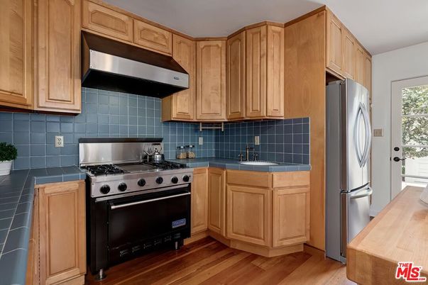 Interior, Kitchen, Stainless Steel Appliances, Tile Countertops, Wood Texture Flooring
