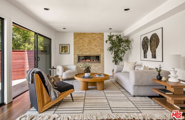 Fireplace, Interior, Living room, Recessed Lighting, Stone Walls, Wood Texture Flooring