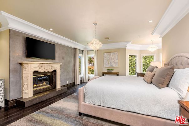 Bedroom, Chandelier, Fireplace, Interior, Recessed Lighting, Wood Texture Flooring