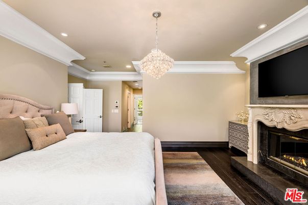 Bedroom, Chandelier, Fireplace, Interior, Recessed Lighting, Wood Texture Flooring