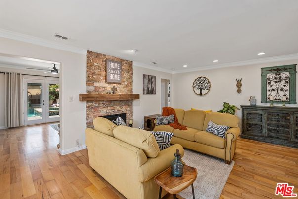 Fireplace, Interior, Living room, Recessed Lighting, Stone Walls, Wood Texture Flooring