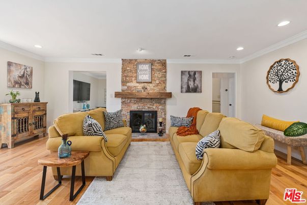 Fireplace, Interior, Living room, Recessed Lighting, Stone Walls, Wood Texture Flooring