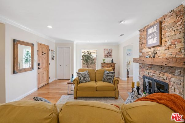 Fireplace, Interior, Living room, Recessed Lighting, Stone Walls, Wood Texture Flooring