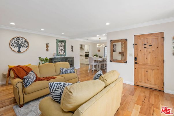 Chandelier, Dining room, Fireplace, Interior, Living room, Pendant Lights, Recessed Lighting, Wood Texture Flooring