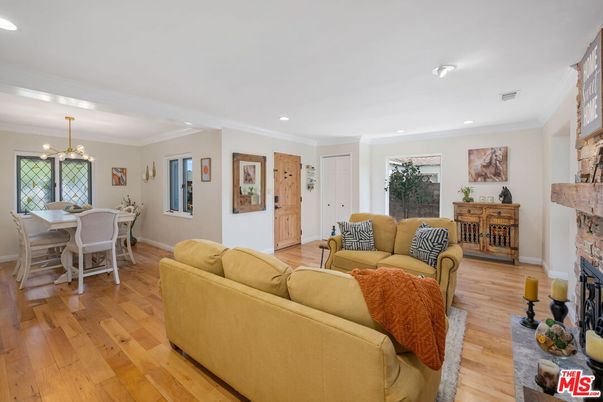 Dining room, Fireplace, Interior, Living room, Pendant Lights, Recessed Lighting, Wood Texture Flooring