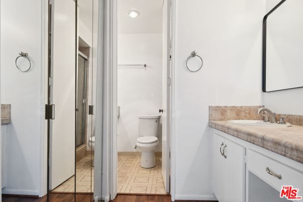 Bathroom, Glass Shower, Interior, Recessed Lighting, Tile Countertops, Wood Texture Flooring