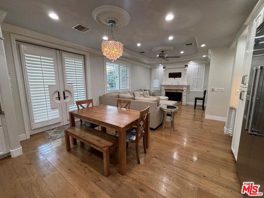 Chandelier, Dining room, Fireplace, Interior, Living room, Recessed Lighting, Wood Texture Flooring