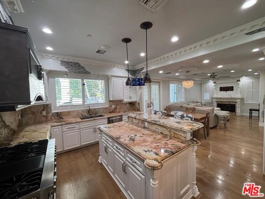 Dining room, Fireplace, Interior, Kitchen, Living room, Pendant Lights, Recessed Lighting, Stainless Steel Appliances, Wood Texture Flooring