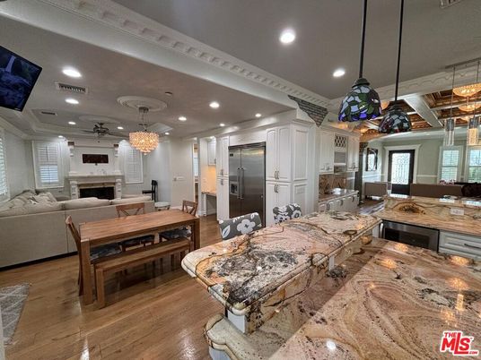 Chandelier, Dining room, Fireplace, Interior, Kitchen, Living room, Pendant Lights, Recessed Lighting, Wood Texture Flooring