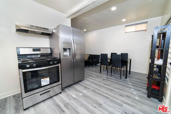 Dining room, Interior, Kitchen, Recessed Lighting, Stainless Steel Appliances, Wood Texture Flooring