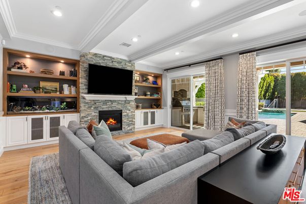 Fireplace, Interior, Living room, Recessed Lighting, Stone Walls, Wood Texture Flooring